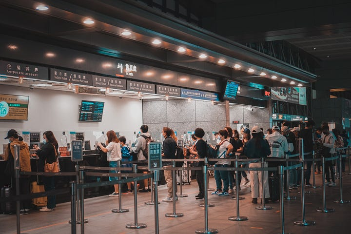 Customers in the supermarket are lining up.